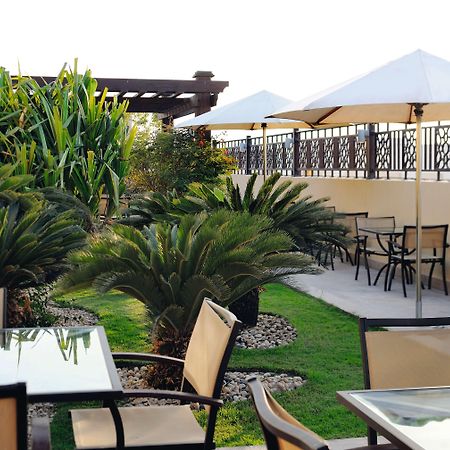 Moevenpick Hotel Apartments Al Mamzar Dubai Bagian luar foto The rooftop garden at the hotel