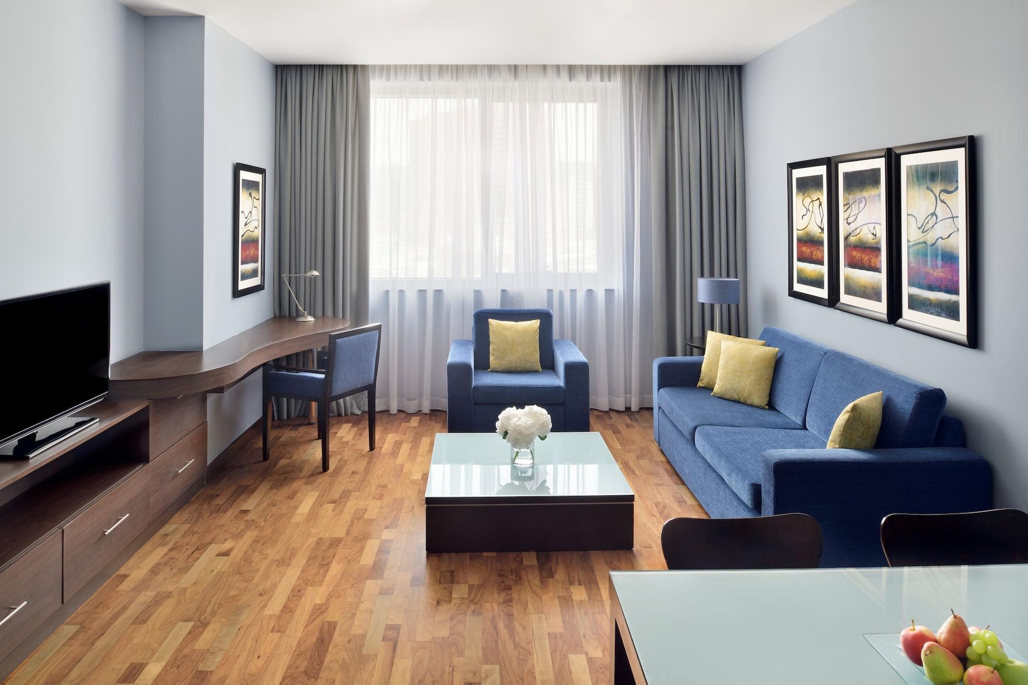 Moevenpick Hotel Apartments Al Mamzar Dubai Bagian luar foto A typical living room