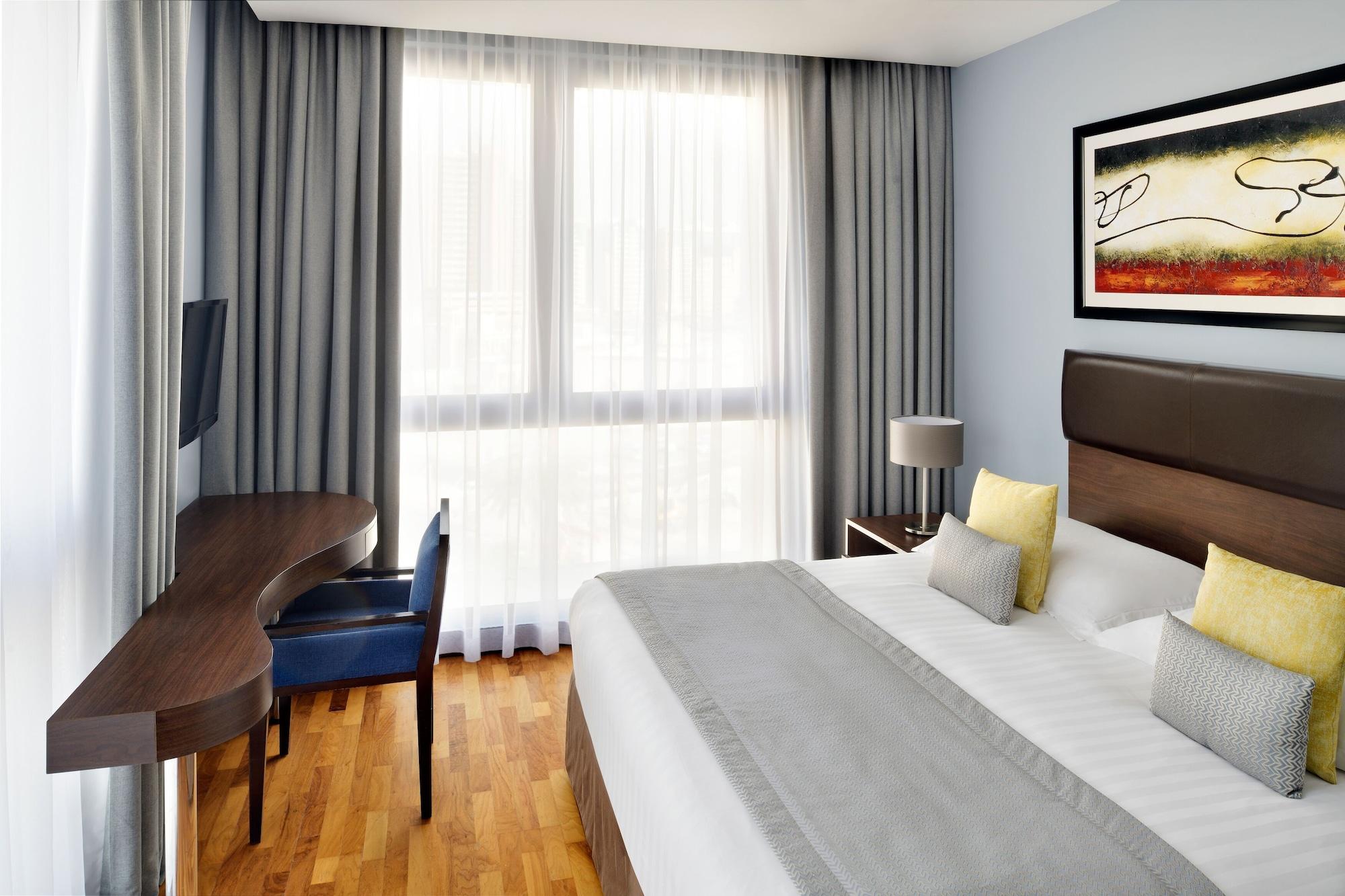 Moevenpick Hotel Apartments Al Mamzar Dubai Bagian luar foto A typical room at the hotel