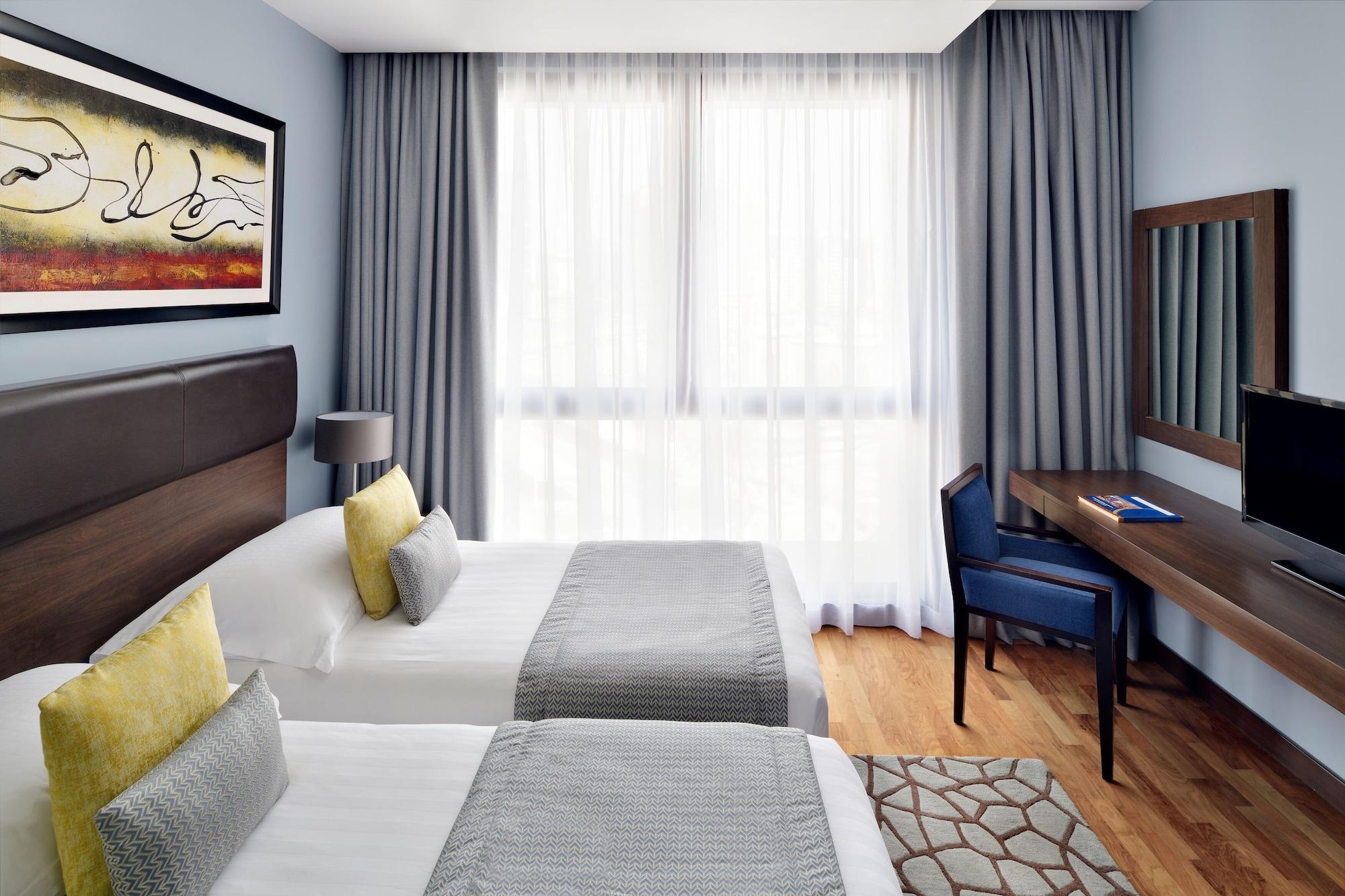 Moevenpick Hotel Apartments Al Mamzar Dubai Bagian luar foto A room at the hotel