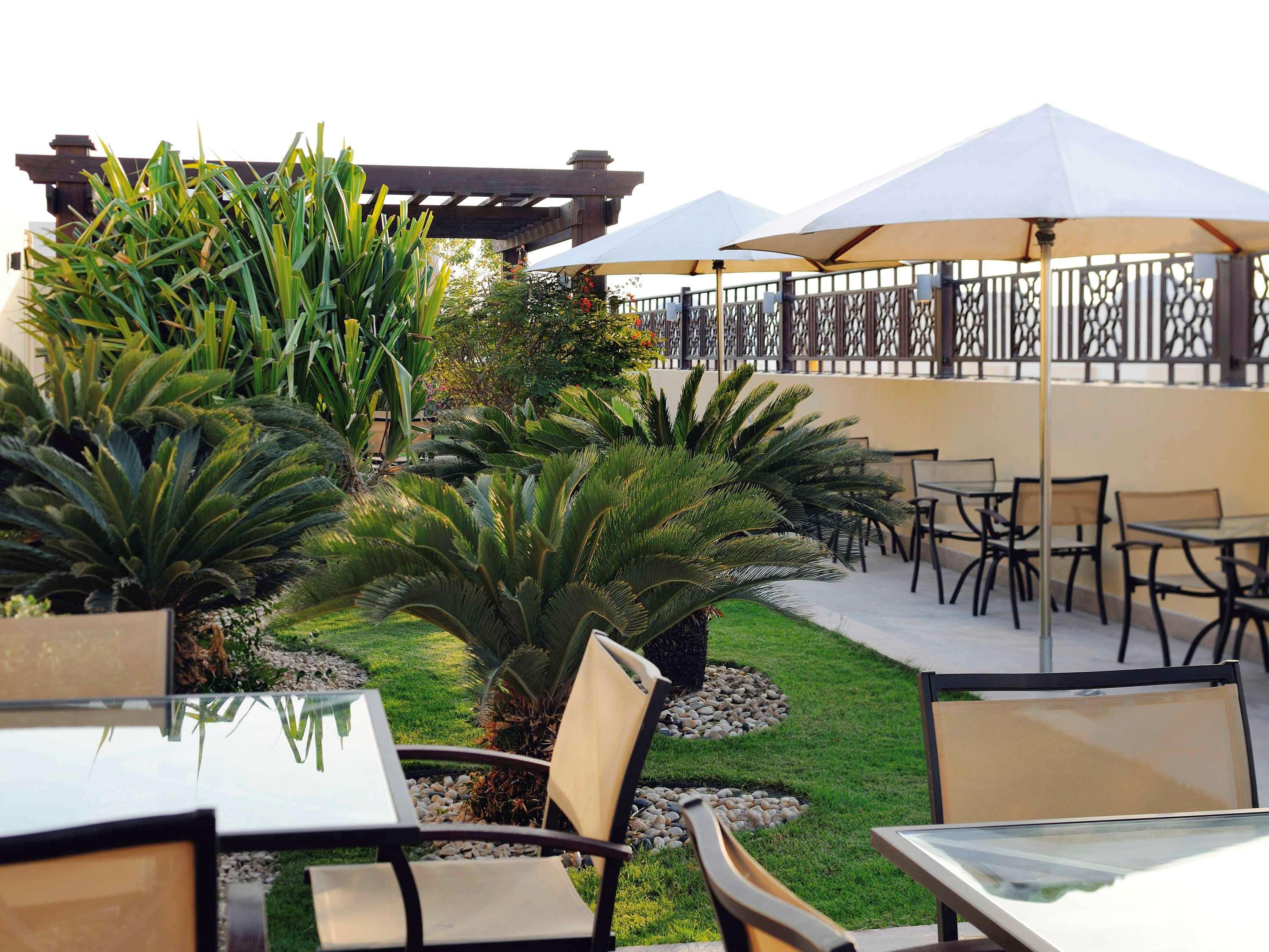 Moevenpick Hotel Apartments Al Mamzar Dubai Bagian luar foto The rooftop garden at the hotel