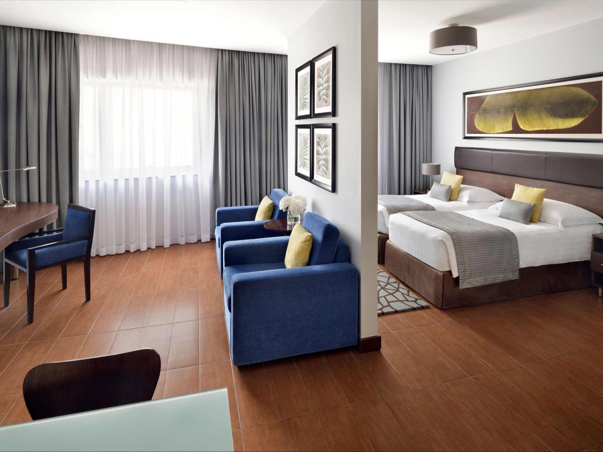 Moevenpick Hotel Apartments Al Mamzar Dubai Bagian luar foto A room at the hotel