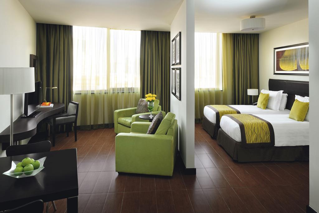 Moevenpick Hotel Apartments Al Mamzar Dubai Bagian luar foto A typical room at the hotel